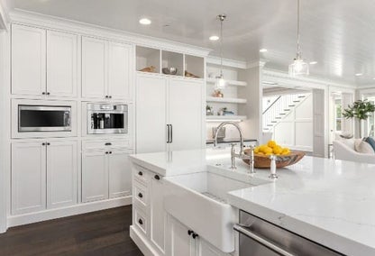 Modern white kitchen in a new home typical of Patchen Wilkes real estate